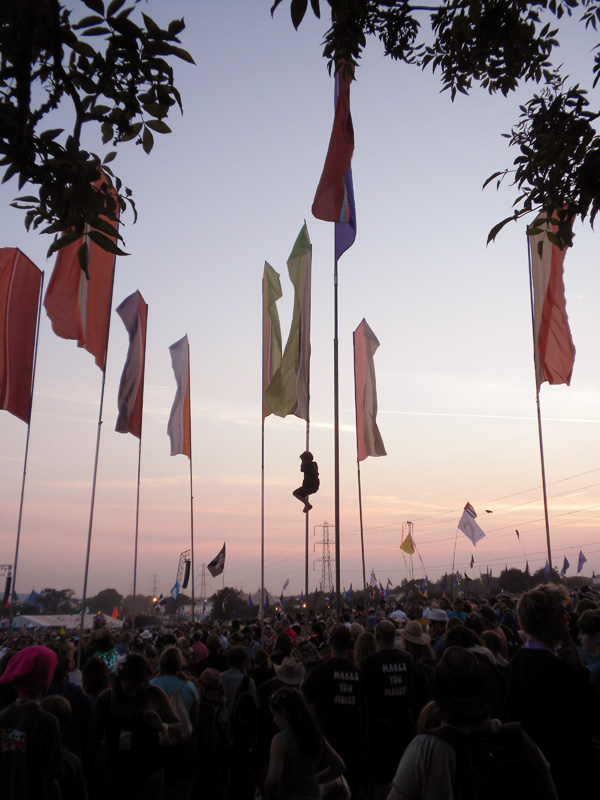 How to work at music festivals and who to contact - Glastonbury Festival boy up pole